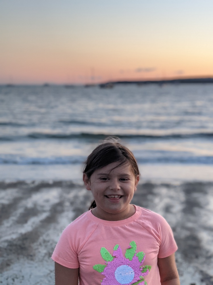 Merida with the sunset behind her